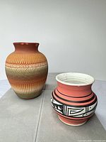 Both vases side by side showing size and decoration