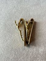 Side angle view with clips slightly open