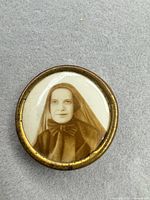 Front view showing portrait and brass frame