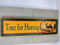 Full view of wooden wall plaque with text and deer graphic