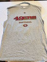 Full front view of gray sleeveless 49ers tee