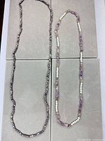 Both necklaces laid out full length for size and bead style overview