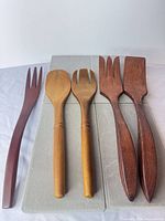 Full view of all five wooden utensils aligned