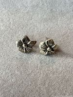 Front view of both floral stud earrings