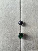 Front view showing green glass stone and blue goldstone bead