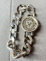 Entire watch laid out showing bracelet and dial