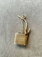 Full view of watering can charm front