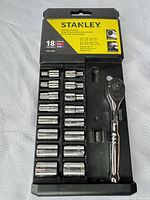 Closed view of case showing STANLEY 18-piece label, sockets and ratchet in tray