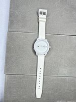 Full view of wristwatch laid flat showing strap and case