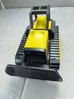Front view showing blade and yellow hood