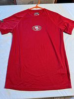 Full front view of red Under Armour 49ers T-shirt