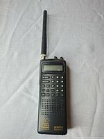 Front view of Uniden BC60XLT scanner showing antenna, keypad, and display
