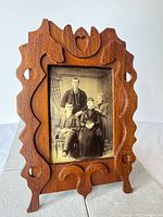 Full view of carved Eastlake wood frame with photo inserted