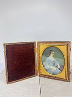 Miniature in open case showing portrait and velvet lining