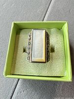 Top view of rectangular sterling silver ring in box