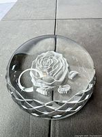 Oblique view showing rose engraving and faceted sides