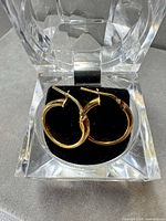 Hoop earrings inside clear display box