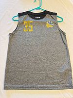 Full front view of jersey showing color, design and number