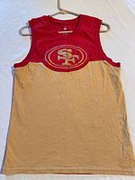Front view of red and gold 49ers tank top on hanger