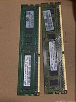 Front view of both DDR3 memory modules showing PCBs and gold contacts