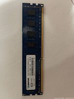 Front view of Royemai 8 GB DDR3 DIMM showing label and four memory ICs
