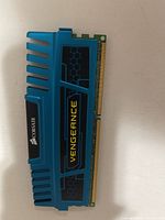 Front view of blue Corsair Vengeance DDR3 module showing branding and contacts