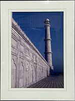 Full view of framed architectural photograph showing marble colonnade and minaret under white mat