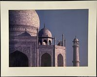 Front view of framed Taj Mahal photograph with mat and partial black frame visible