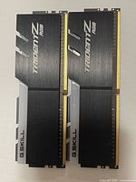 Front view of both G.SKILL Trident Z RGB DIMMs showing heat spreaders and RGB bar