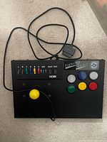 Top view of Hori Fighting Stick showing joystick, buttons and cable
