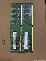 Two Hynix 1GB DDR2 DIMMs front view showing PCB and gold contacts