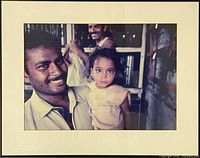 Framed photograph showing entire item with frame, mat and image