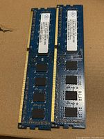 Front view of both Nanya DDR3 DIMMs showing IC layout