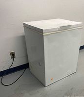 Front and side view showing overall freezer body and power cord