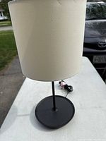 full view of lamp showing shade, stem and base