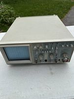 Front view showing screen and control panel of oscilloscope