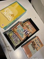 Outer slipcase and open tray showing sealed CD volumes