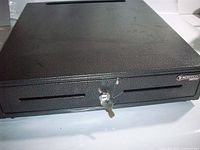 Front view showing Hercules logo, dual media slots, key in lock