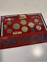 Front of sealed Iraqi coin set showing nine coins and printed information
