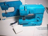 Front view of Janome 525B machine with foot pedal, manual and box