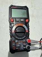 Front view of Kaiweets HT118A multimeter showing screen, selector dial, input jacks and brand