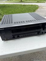 Front and top view showing controls, display and ventilation grilles