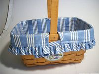 Side view showing woven body, fabric liner and handle
