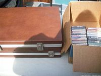 Carry case closed beside box of tapes