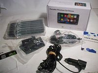 All components laid out: boxed stereo, accessories in bags, power cord, manual