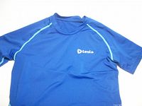 Front view of blue Tesla athletic T-shirt showing size and style