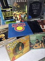Front group shot of several featured LP covers