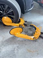 Two wheel boot clamps positioned on vehicle wheel