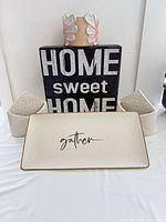 Group shot showing wooden sign, tray, large pot and two small planters