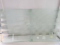 Both glass boards side by side showing frosted patterns and rubber corner feet